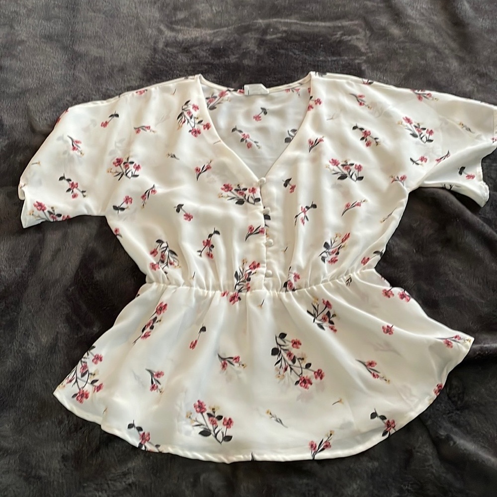 Short sleeve, white button-front peplum blouse